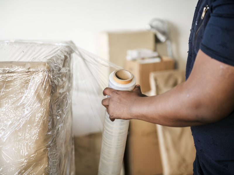 black-man-moving-furniture-min